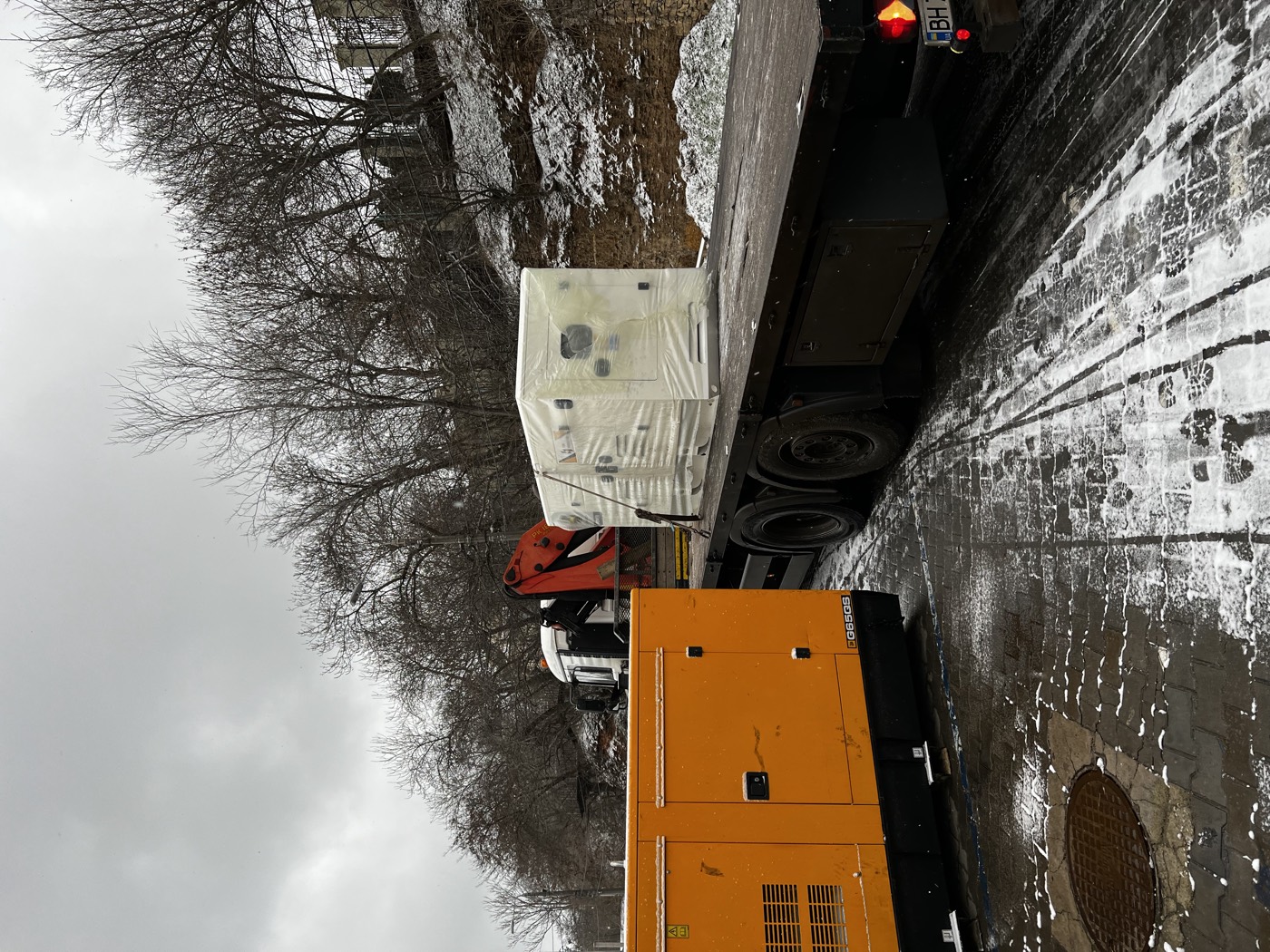Generator sets delivered on a snow-covered road in winter
